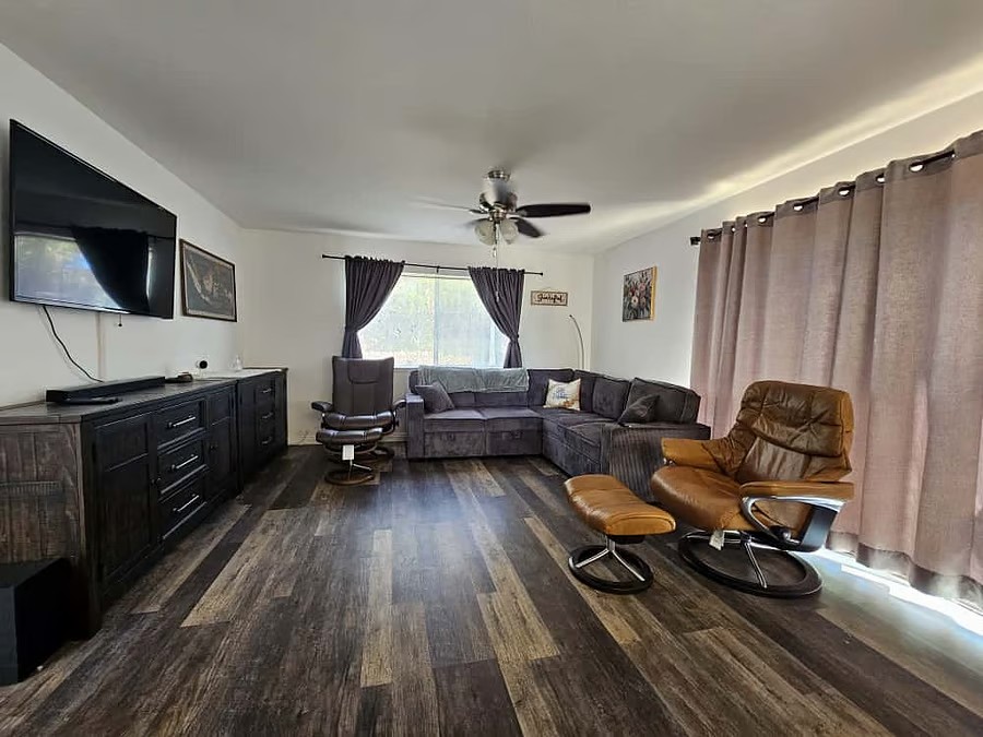 Shared living room with seating and TV